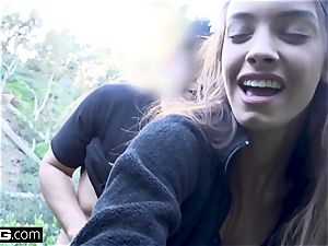 Charity Crawford gets her beaver stretched outdoors