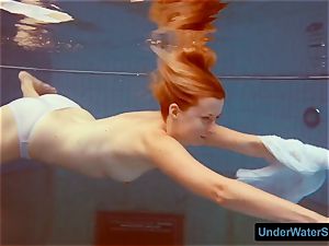 redhead in a milky dress and uber-sexy bathing suit